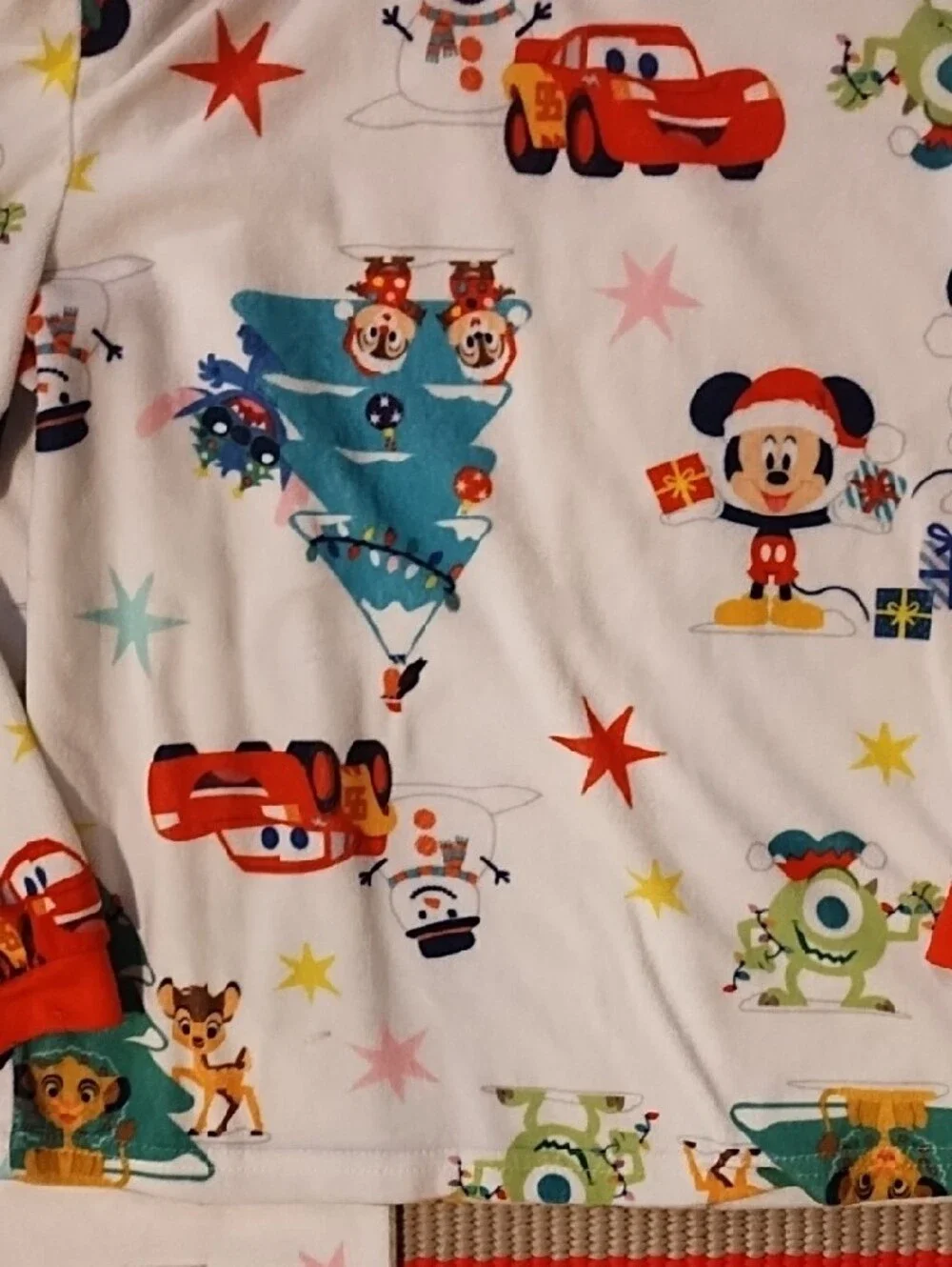 Disney Kids Holiday Pajama Set - White with Red Accents and Multicolor Prints.